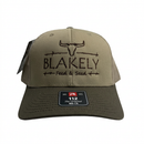 Tan BF&S Richardson 112 hat with embroidered Blakely Feed & Seed logo and dark brim